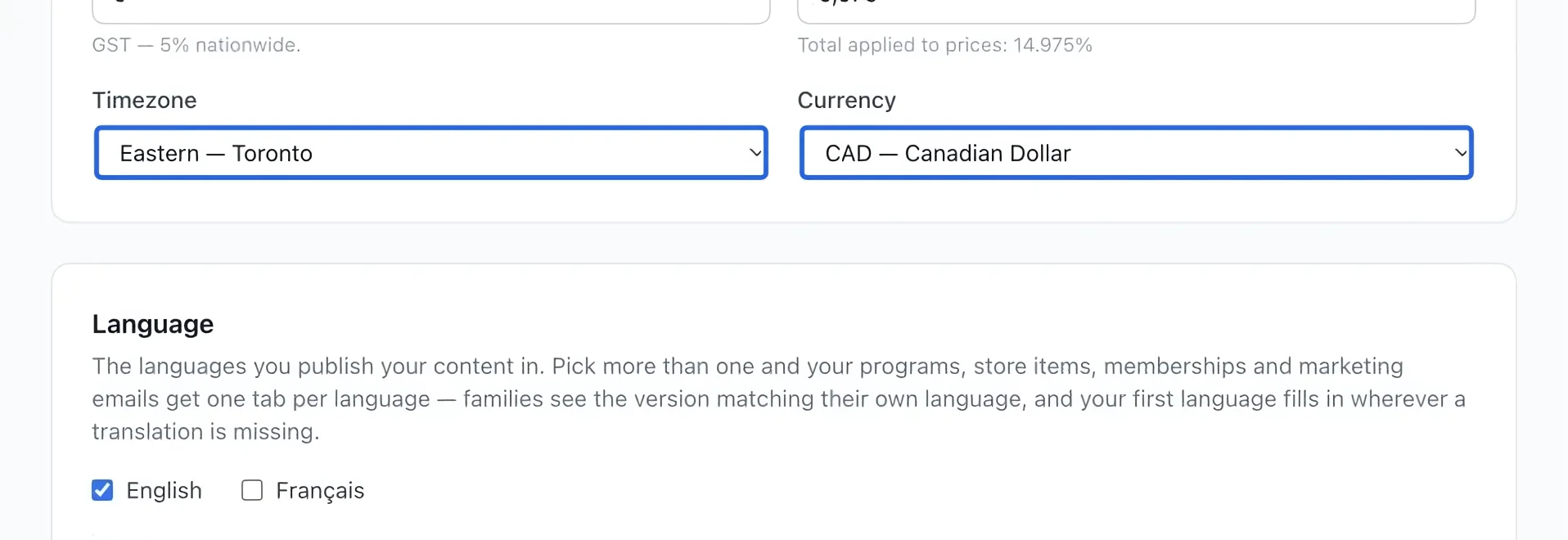 Screenshot: Set timezone and currency. The blue outlines identify the controls described in this step.